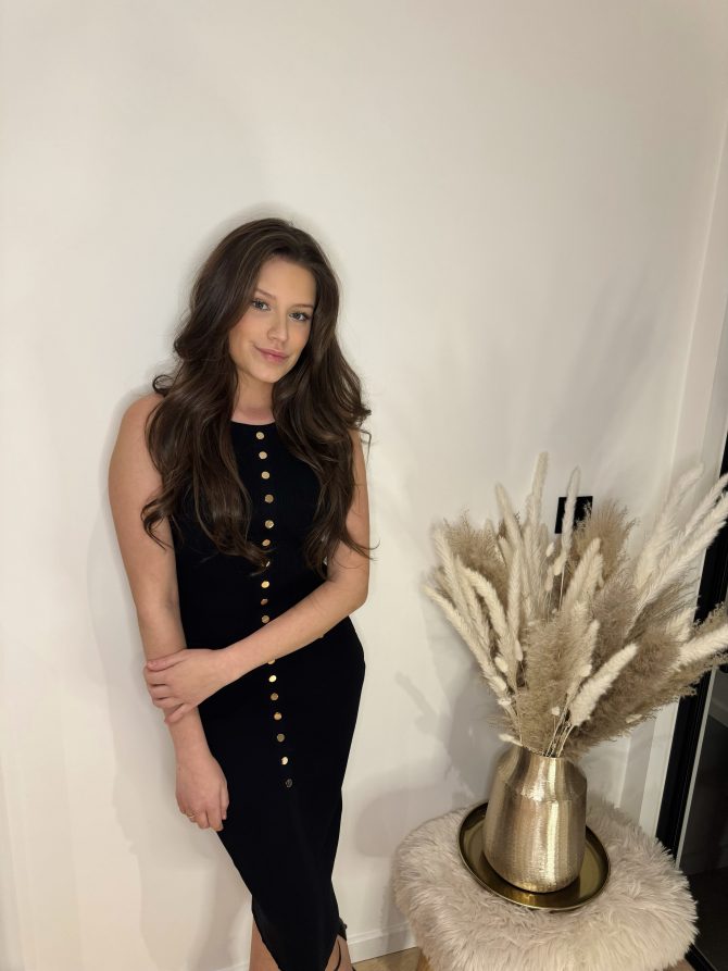 Black midi dress with golden buttons